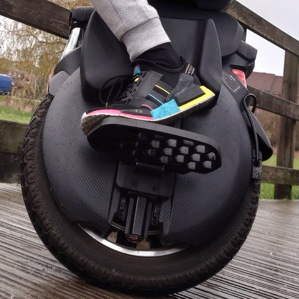 User stepping on honeycomb foot pedal of INMOTION V11 V12 V13 unicycle
